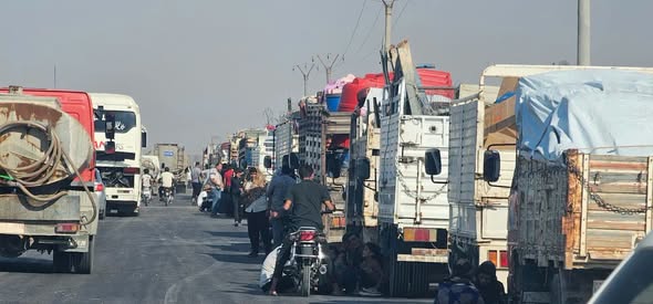 After seven years of displacement.. The first convoy of Ras al-Ain (Sere Kaniye) IDPs departs Hasakah for the city